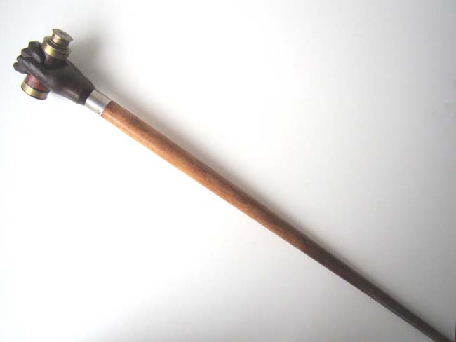 A 20th century Walking Stick featuring a carved 'clenched fist' knob holding a small telescope — image 2